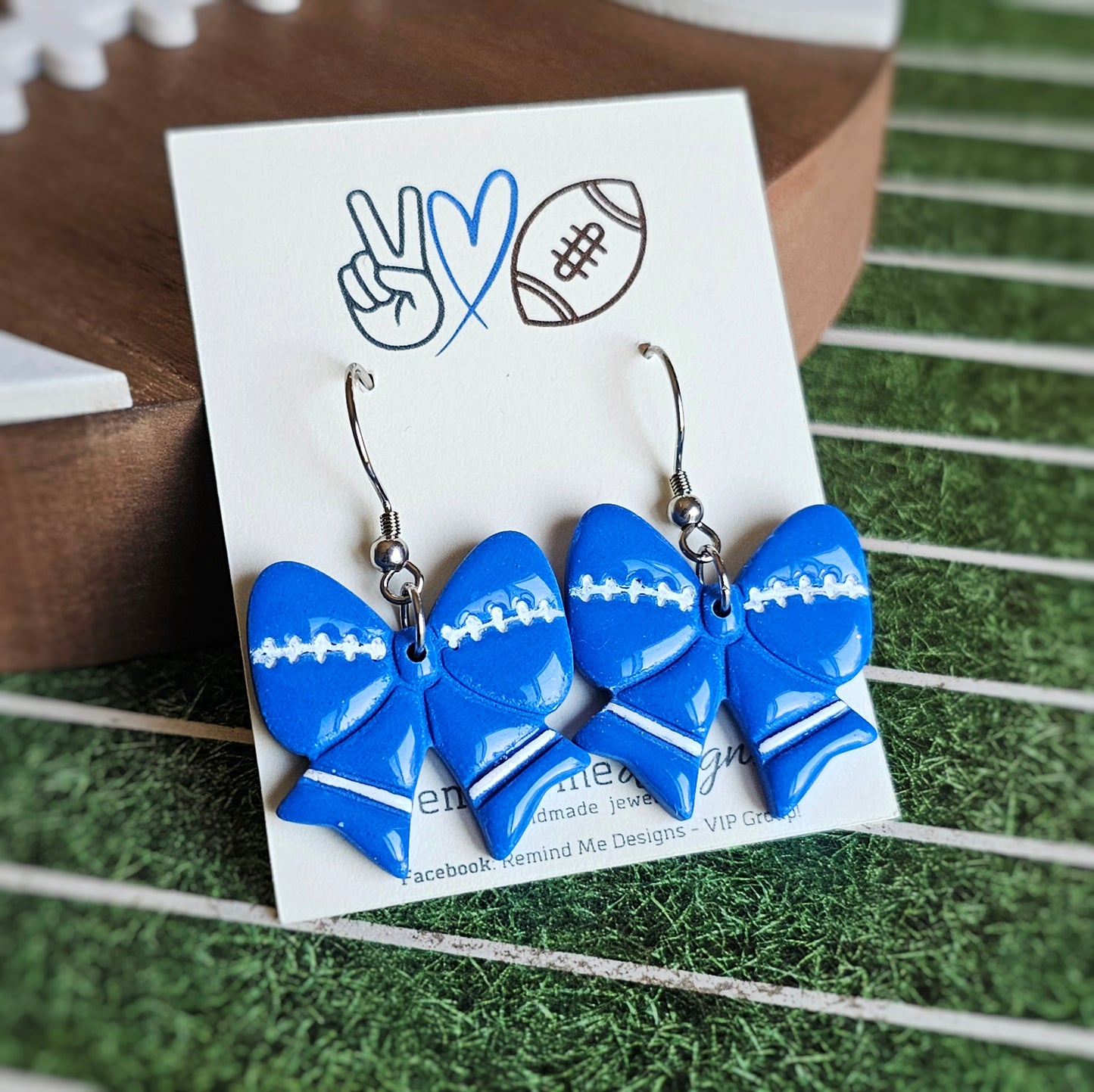 Royal Blue and White Football Bow Clay Dangle Earrings