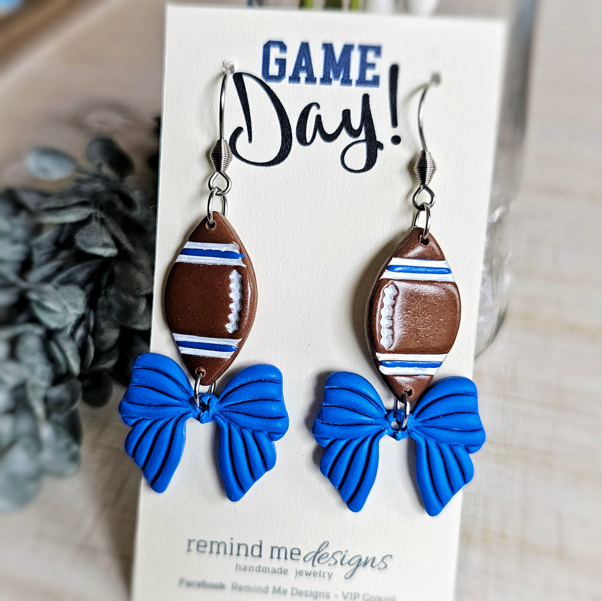 Brown Football with Blue Bow Clay Dangle Earrings