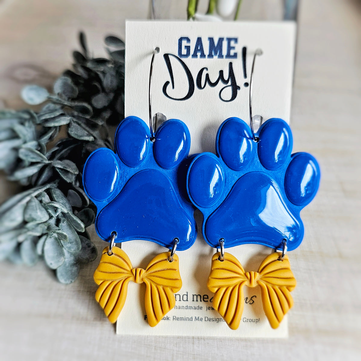 Large Blue Paw and Gold Bow Clay Dangle Earrings