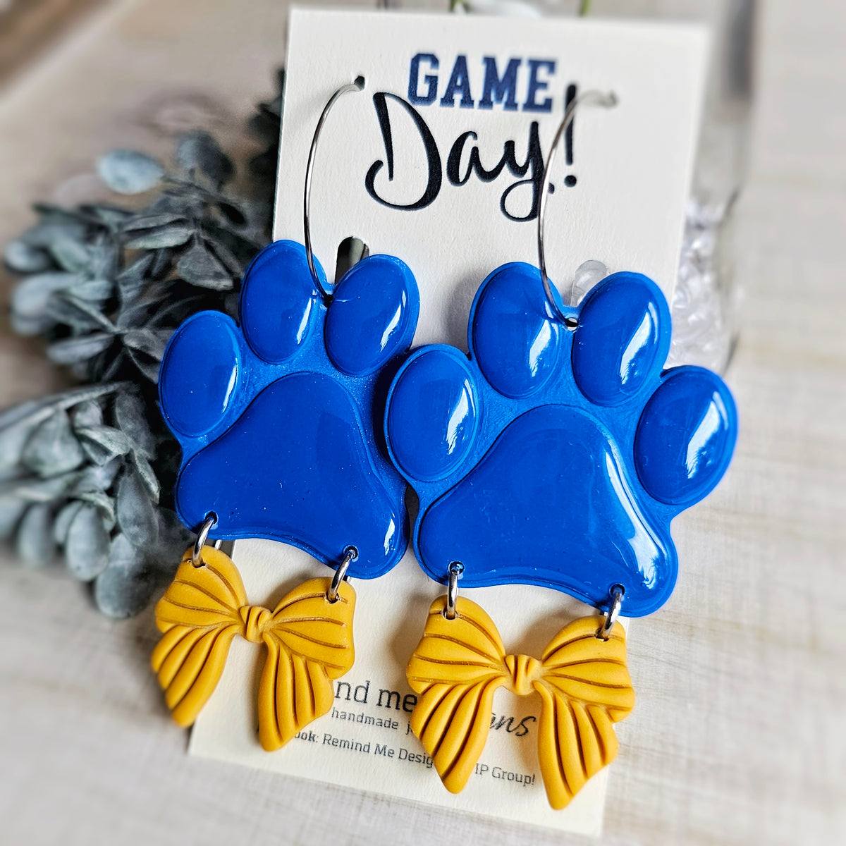 Large Blue Paw and Gold Bow Clay Dangle Earrings