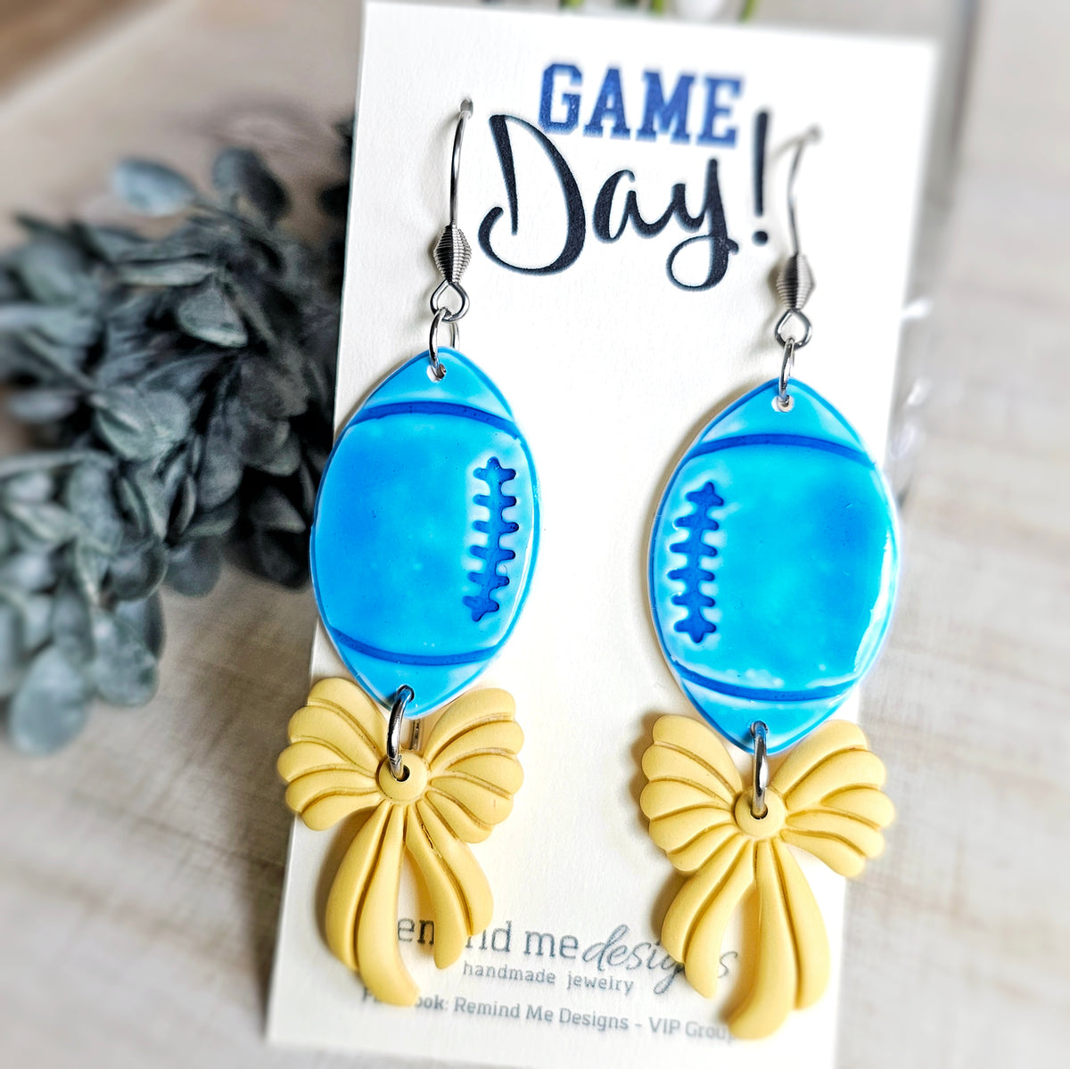 Blue Football with Yellow Bow Clay Dangle Earrings