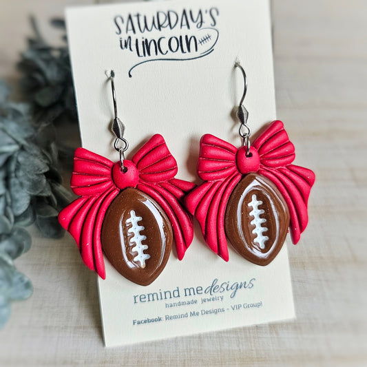 Brown Football with Red Bow Clay Dangle Earrings